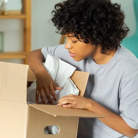 Person opening a product package at home