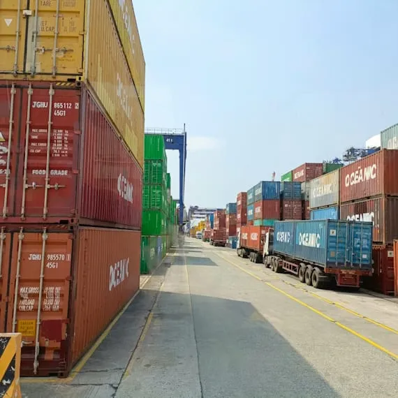 Shipping containers and trucks at a container yard